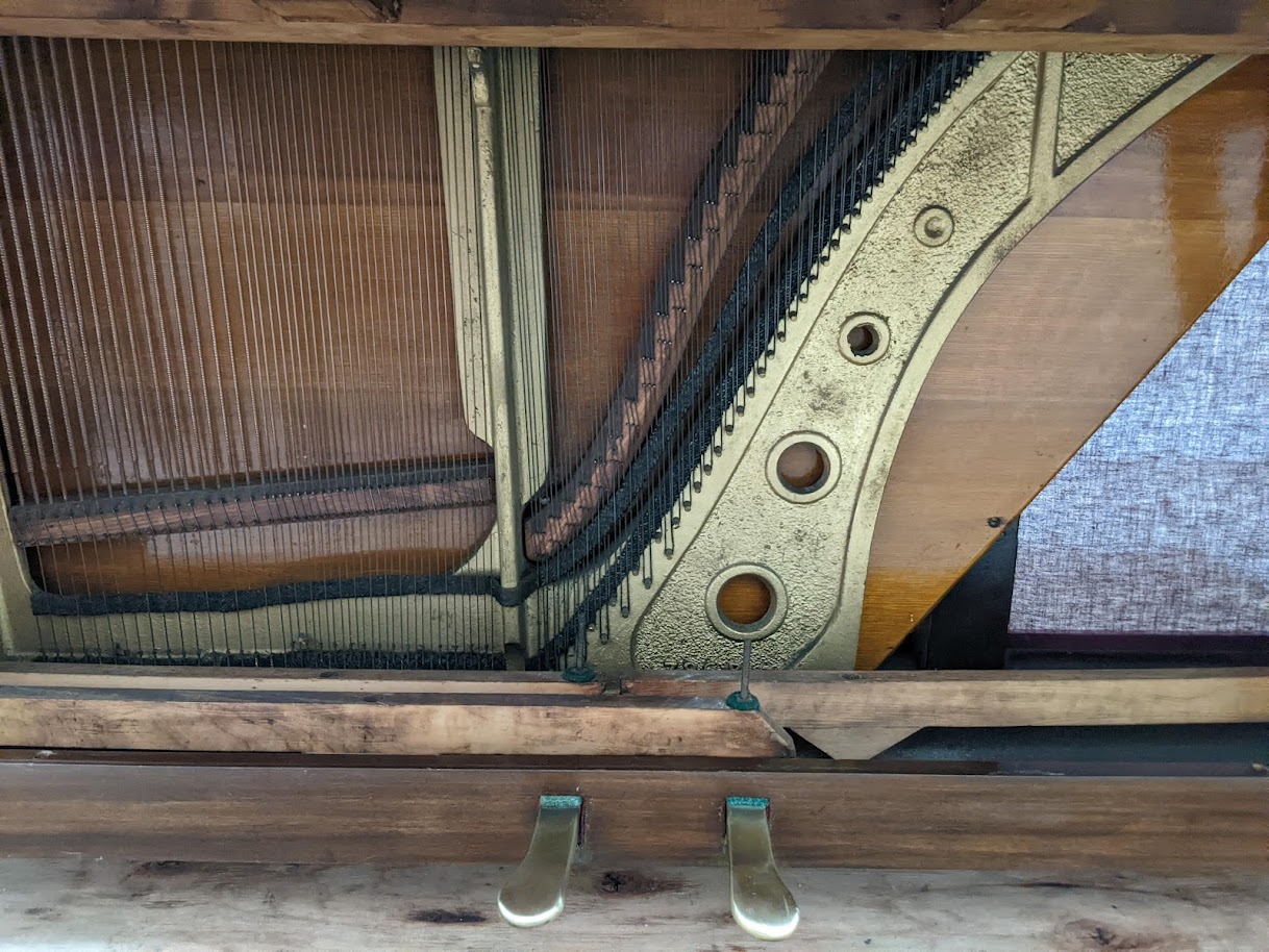 Close up of trap work and pedals on the Paul Gerard  Upright Piano