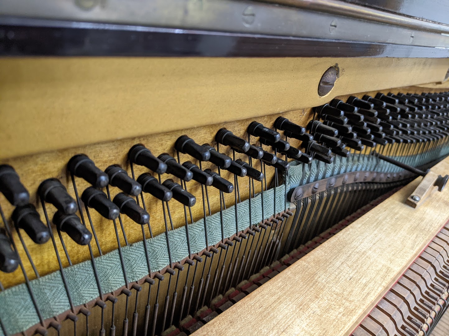 View of tuning pins of the Boyd Upright Piano c1930