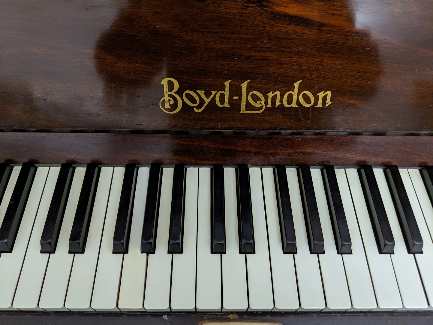 Boyd London decal on fall of Piano