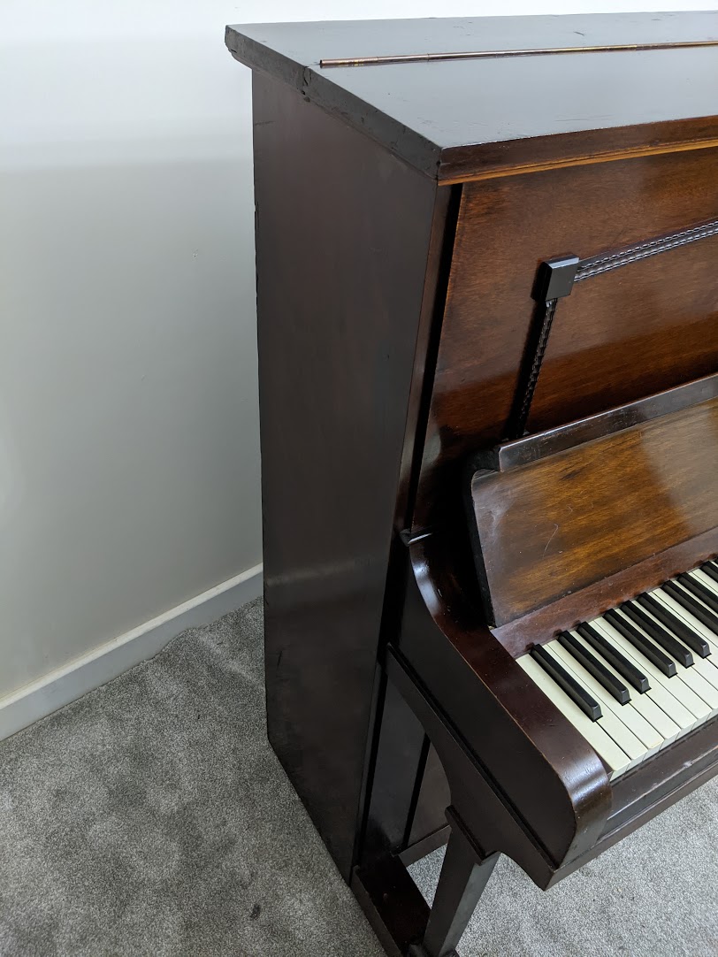 Side view of left hand side of the Boyd Upright Piano