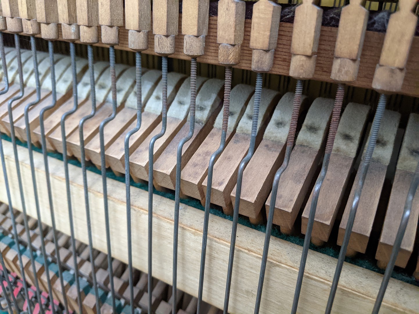 Close up of the reconditioned action of the c9103s Boyd Upright Piano, Reconditioned by Matthew James Richards 